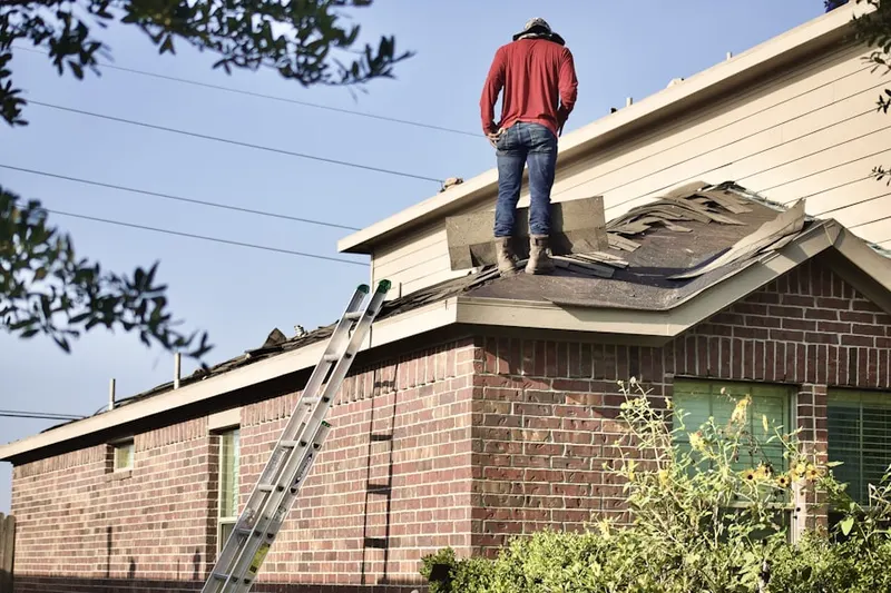 Professional roofer working on a residential roof in Vienna